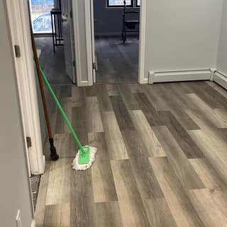 New luxury vinyl plank flooring laid through a freshly painted apartment
