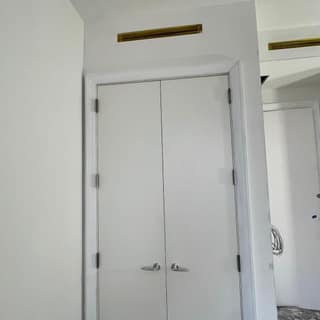 Finished double closet doors and trim painted crisp white
