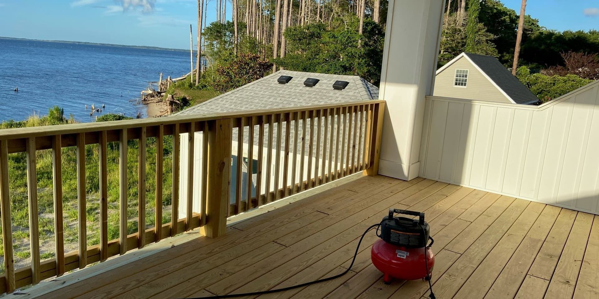 Completed cedar deck and railing built and finished by GM 5.0 Construction